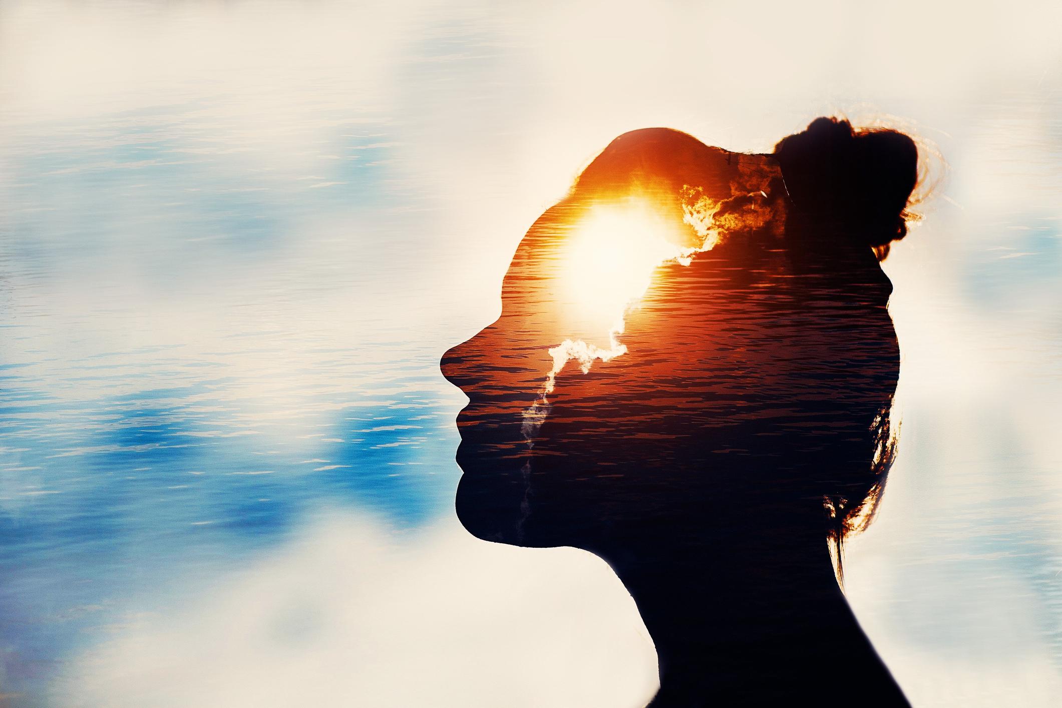 Light shining on the silhouette of a female head